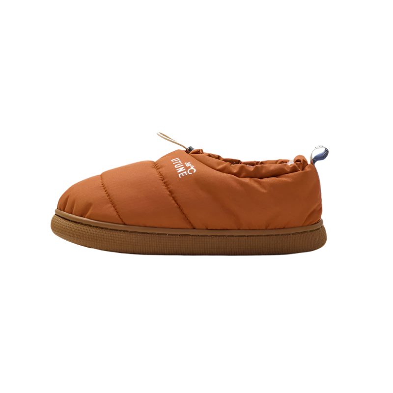 Orange slip-on shoe with 'UTUNE' branding on a beige background