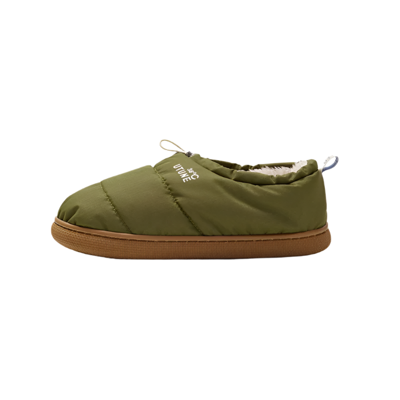 Green slip-on shoe with brown sole on a beige background, featuring the brand 'UTUNE'.
