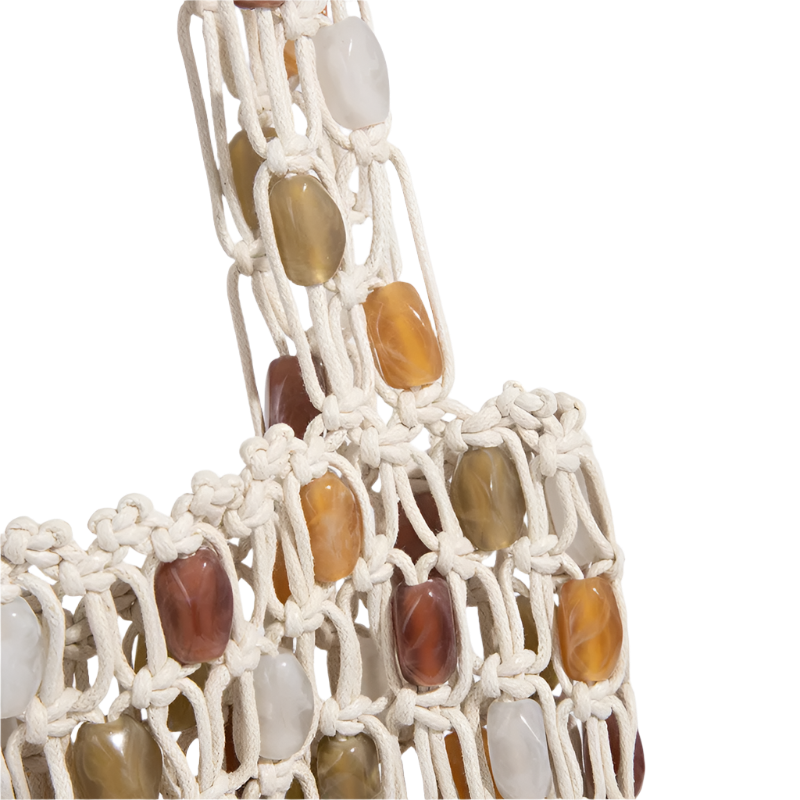 Macrame wall hanging with multicolored stones on a white background